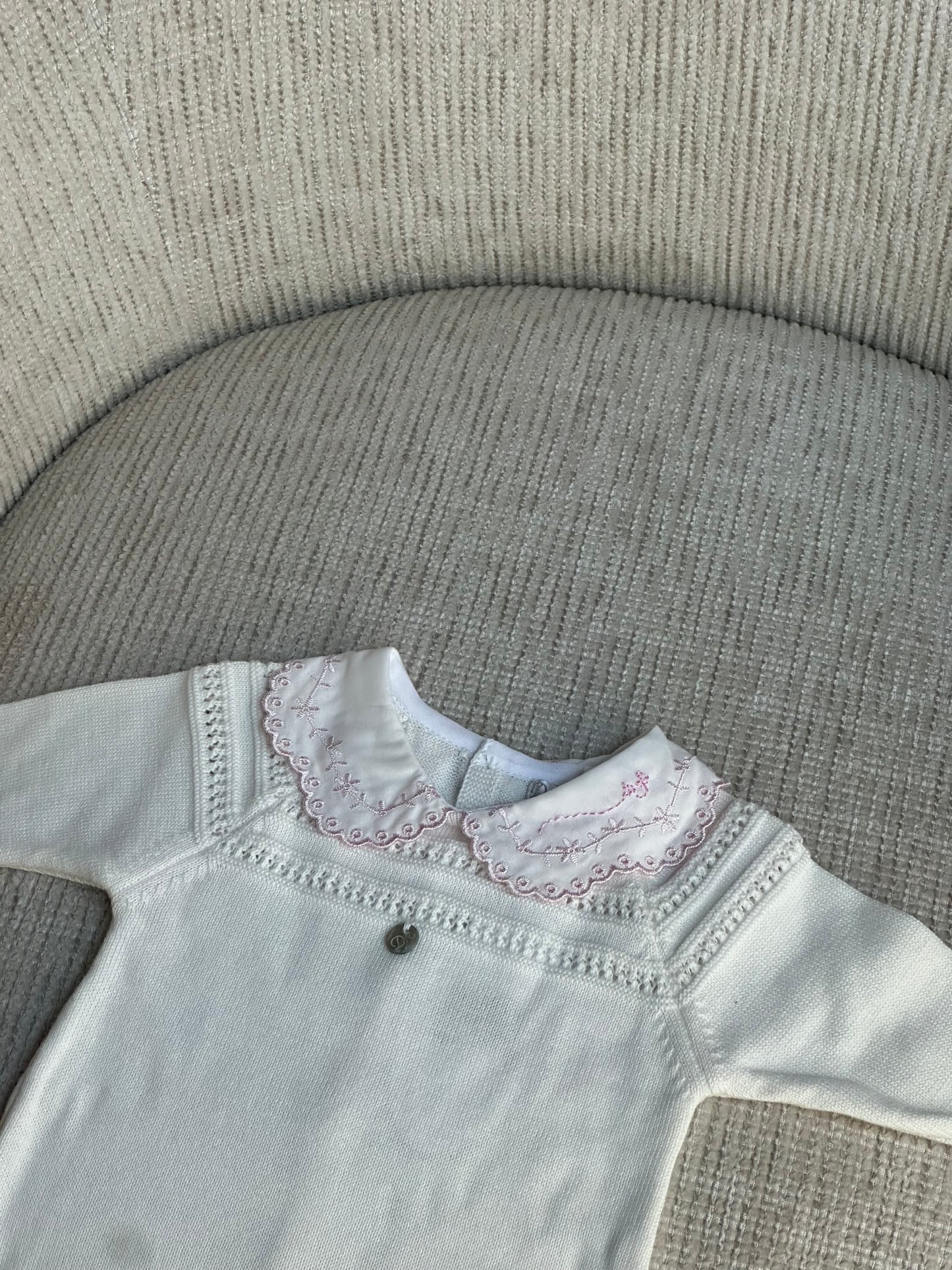Ivory babygrow with pink trim