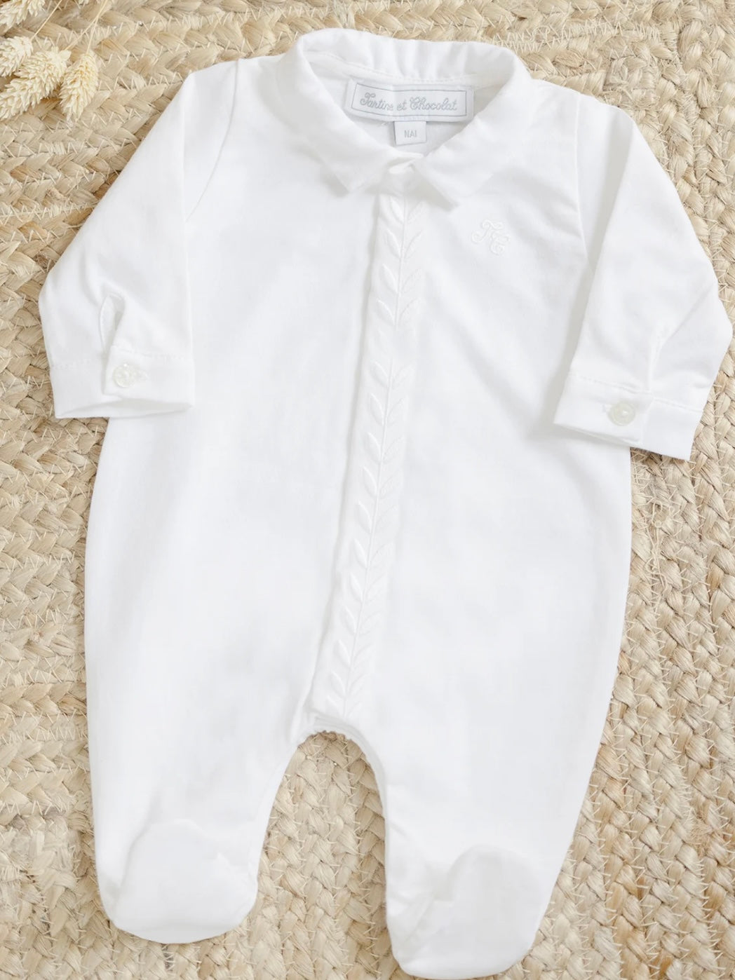 White cotton babygrow
