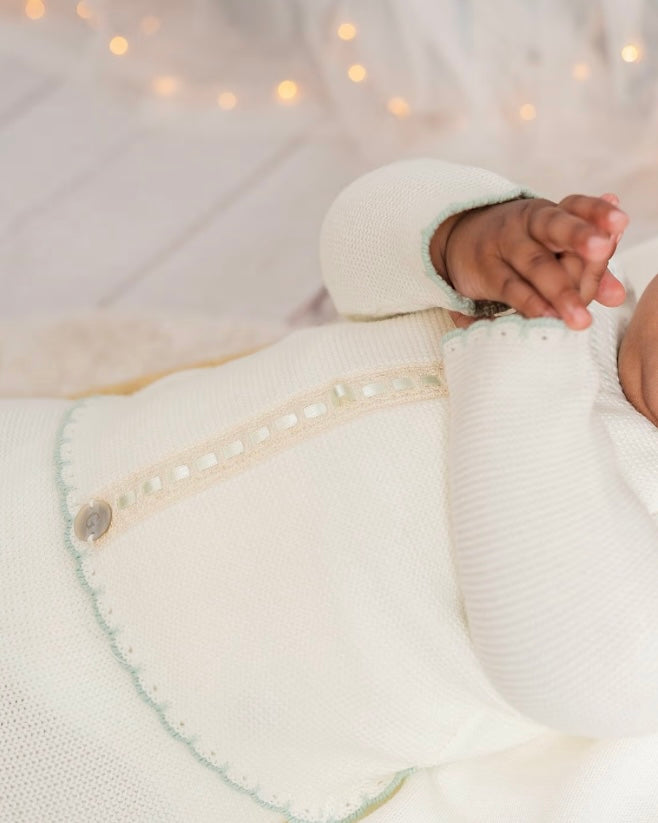 Ivory babygrow set with pale green trims